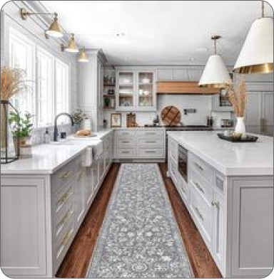 Comfortable office with plants, wooden desk, and two black chairs